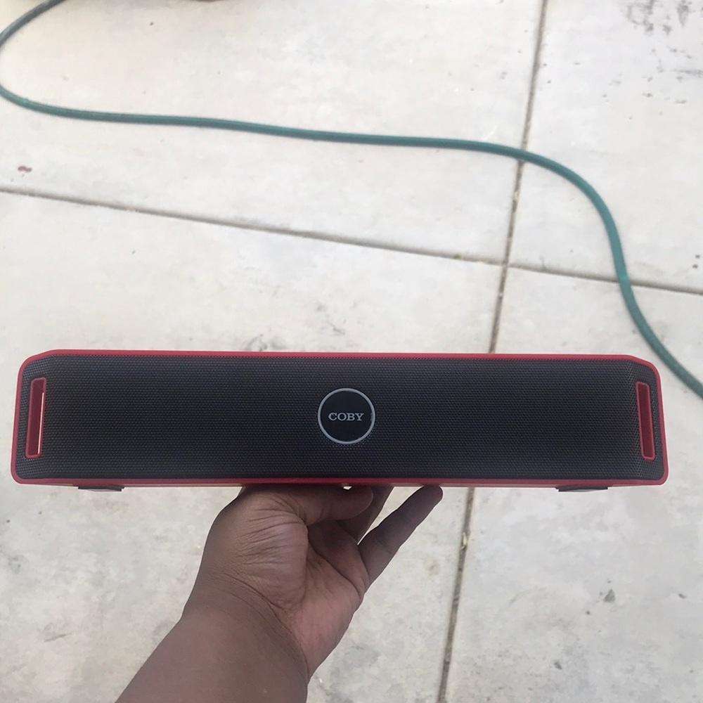 Red And Black Coby Wireless Bluetooth Speaker.